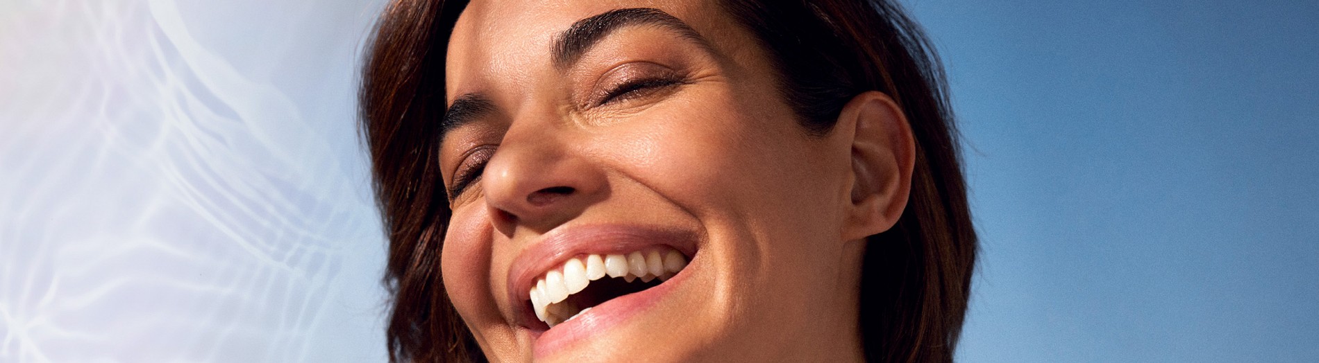 Woman with radiant, hydrated skin after babyGLOW Teoxane skin booster treatment at Dermal Clinic Edinburgh